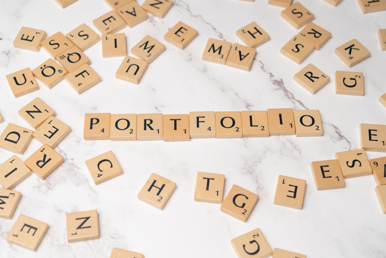 Scrabble tiles spelling PORTFOLIO on a marble surface. Perfect for business and creativity themes.